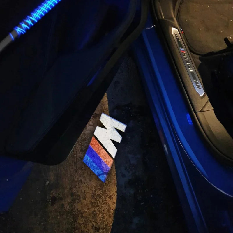 BMW LED car door welcome logo lights projecting logo on ground at night