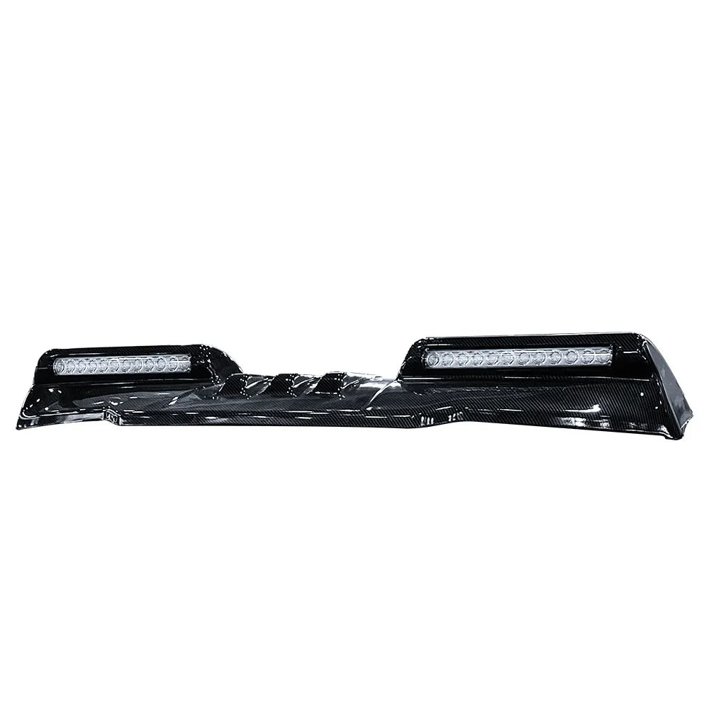 Carbon look LED roof light bar pod for Ford F-150 Raptor featuring integrated lighting and aggressive off-road exterior styling.