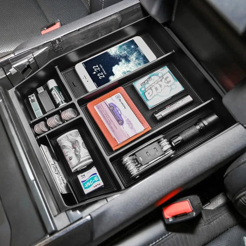 Custom center console organizer tray for Ford F-150 and F-150 Lightning with durable ABS construction, anti-slip rubber liners and multiple storage compartments.