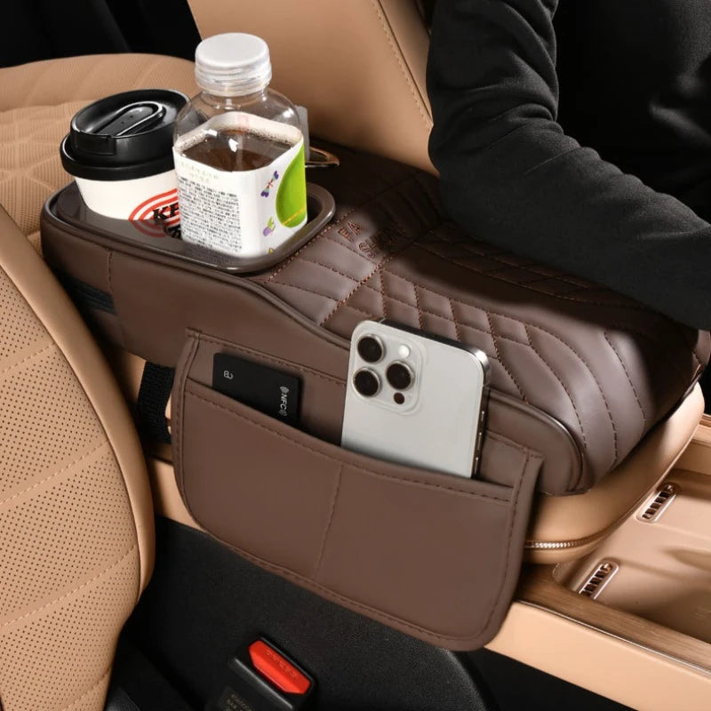 Universal car armrest with storage compartment and cup holder, installed in vehicle center console for comfort and organization.